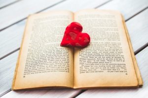 red heart in open book