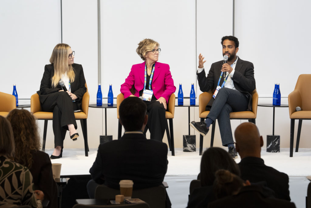A photo of three people during a panel discussion.