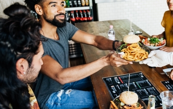 man eating burger