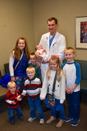 Dr. Gregory Reynolds with the Smith children. Dr. Gregory Reynolds with the Smith children.