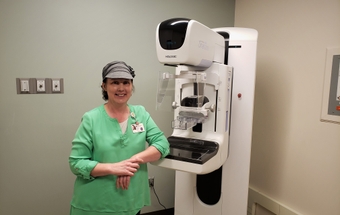 Terrie Loflin with 3-D mammography machine_201906141803