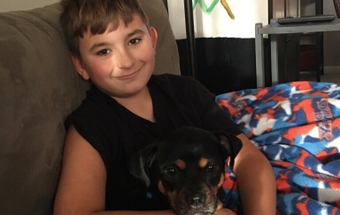 Levi relaxing with his dog, Bandit. Levi and Bandit