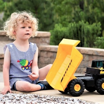 Shea began school in October, and is playing soccer. Shea with truck