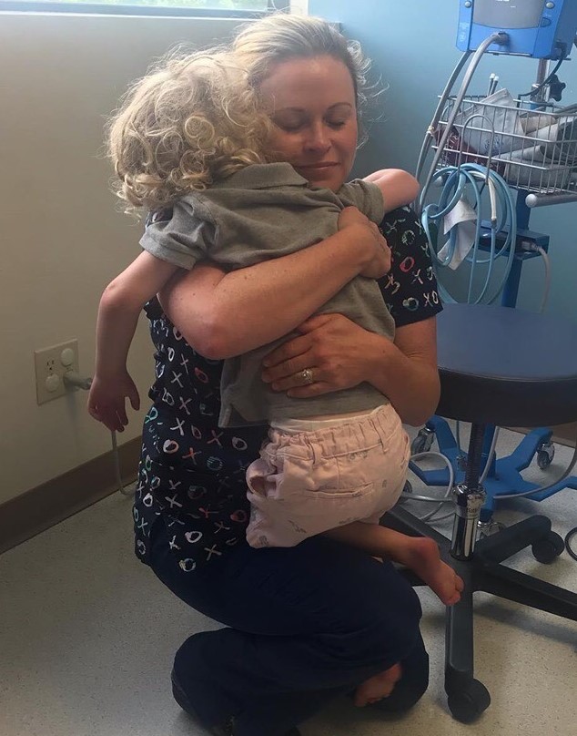 Shea hugging nurse Emily Weaver. Shea hugs Emily Weaver