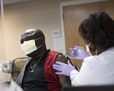 Denis Neba was happy to get his COVID-19 vaccine. He viewed it as just getting another vaccine, _DSC5034toned