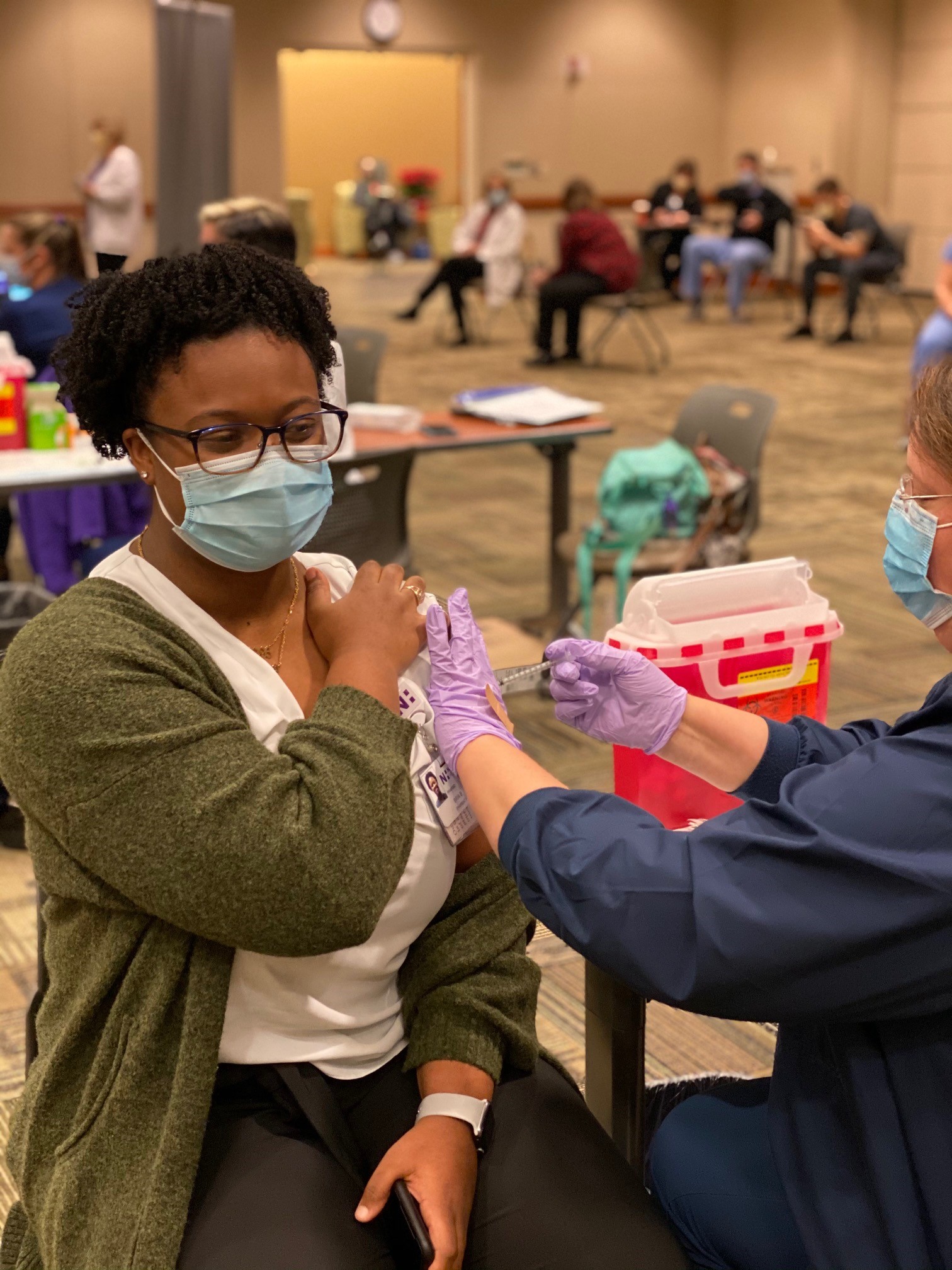 Bria Benson receives a COVID-19 vaccine. Bria Benson receives a COVID-19 vaccine.