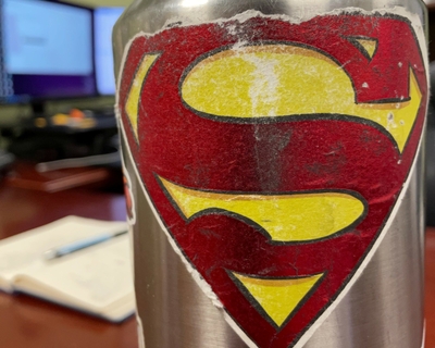 Bodhi Cooke thinks his dad is Superman, and he gave him a sticker to prove it. Jason Cooke Superman detial