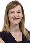 Dr. Kasey Scannell wears a black shirt and is smiling