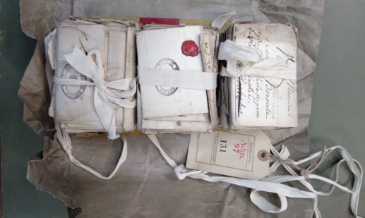 Three bundles of handwritten vintage letters, bound with ribbon
