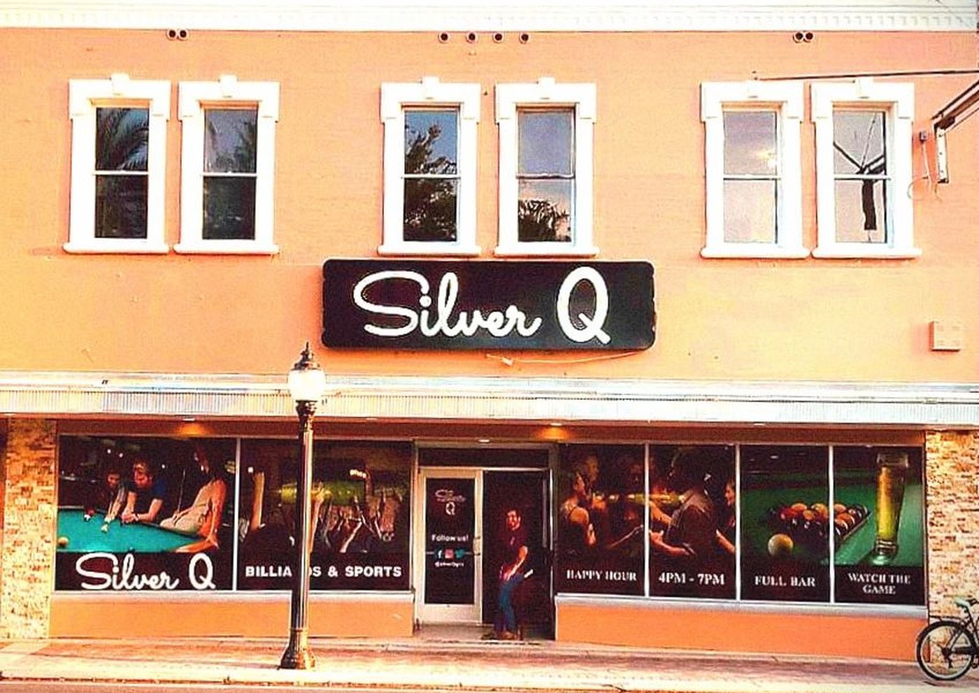 The Silver Q storefront on West University Avenue at dusk.