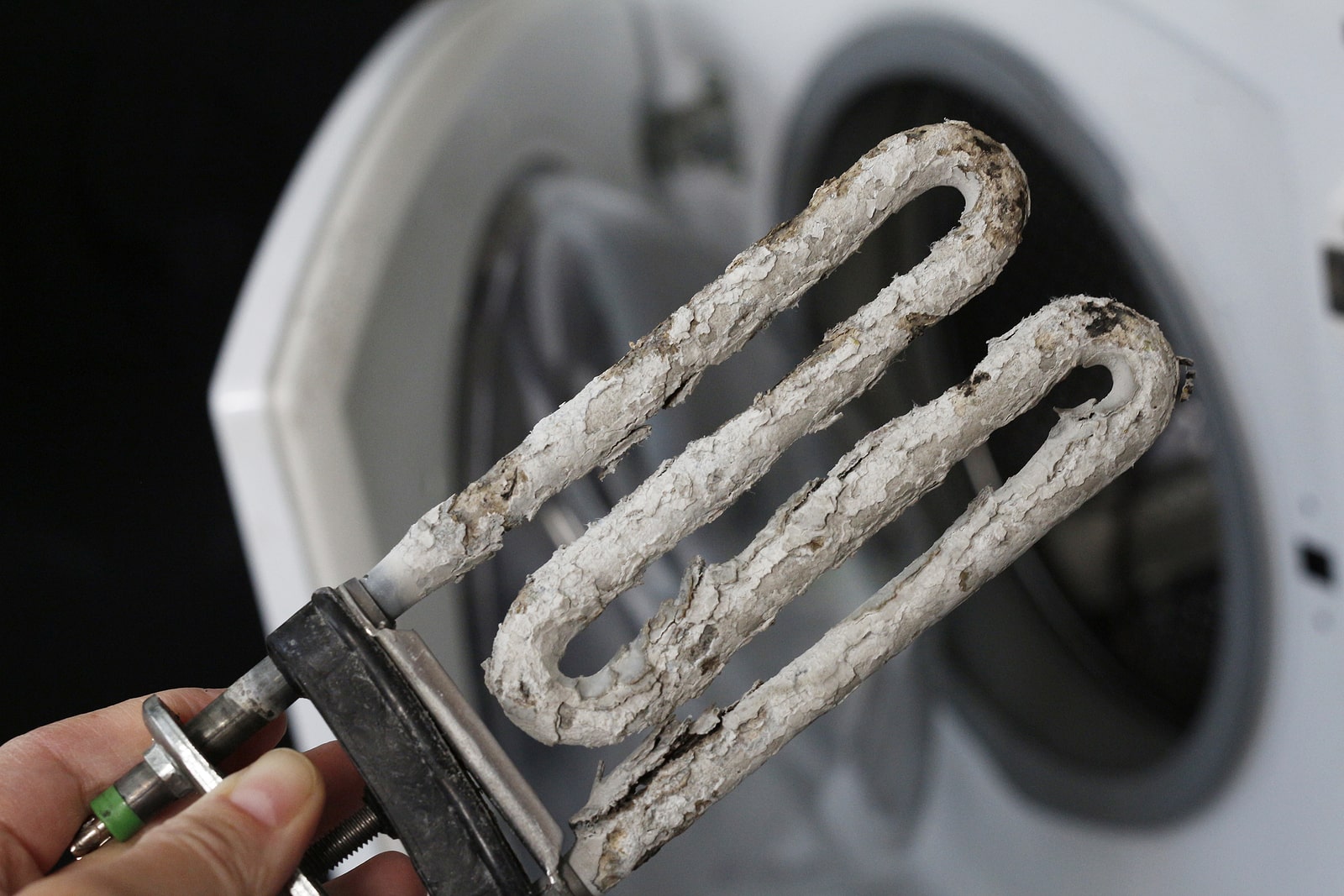 Hard water effects on a washing machine element. 