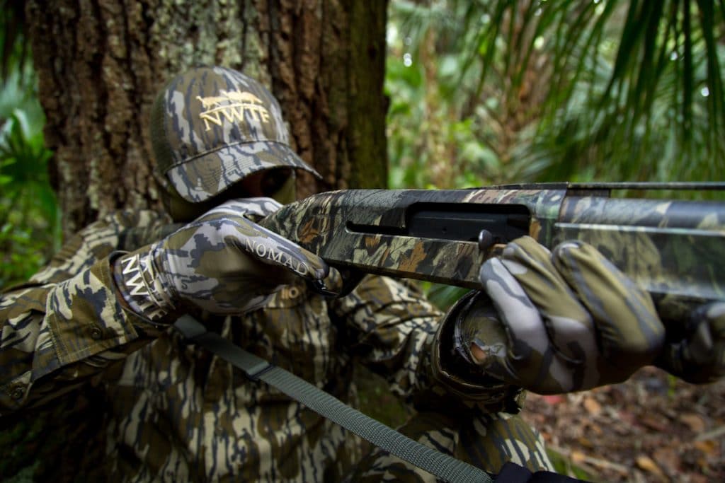 Hunter holding a shotgun