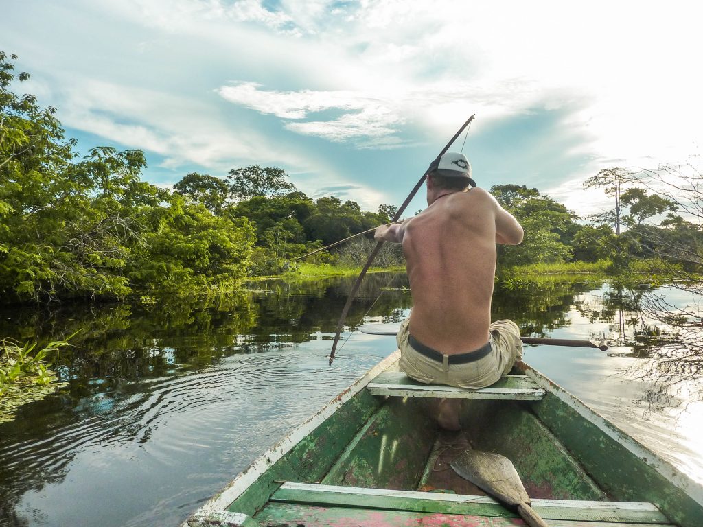 Bow hunting in the middle of the amazon rain forest in Brazil.