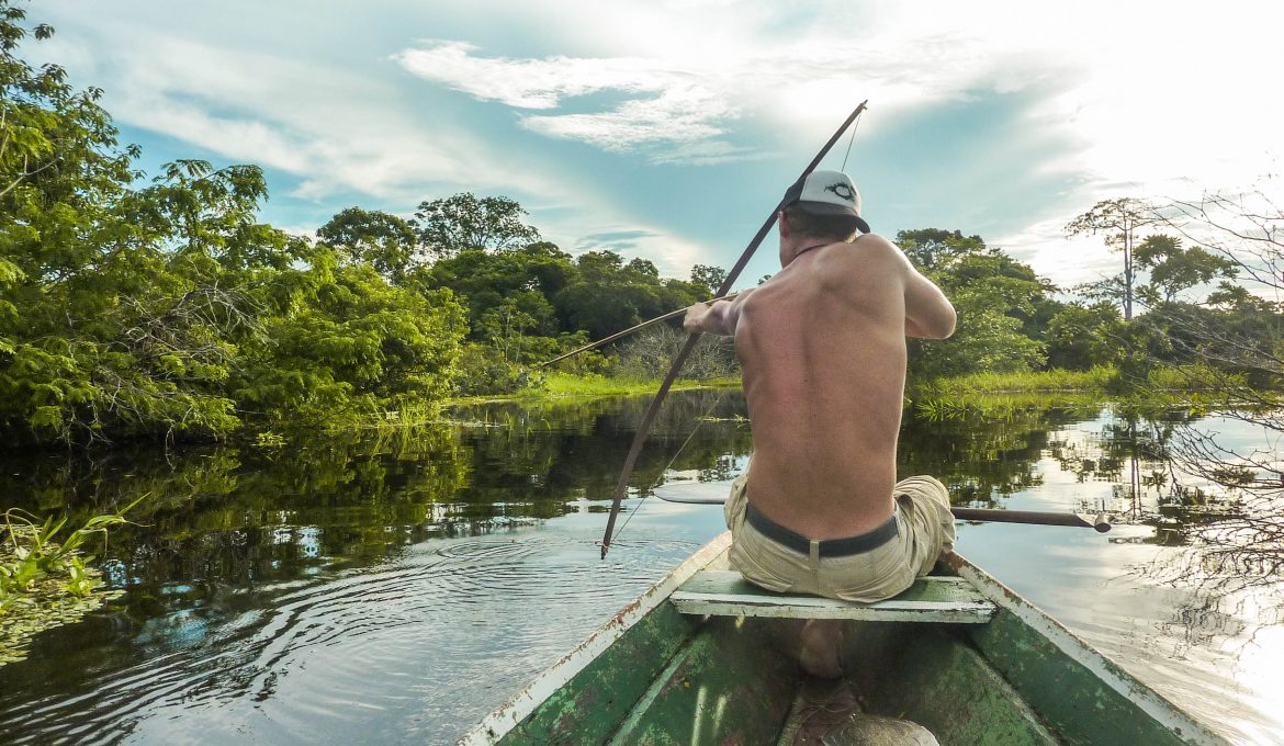 Bow hunting in the middle of the amazon rain forest in Brazil.