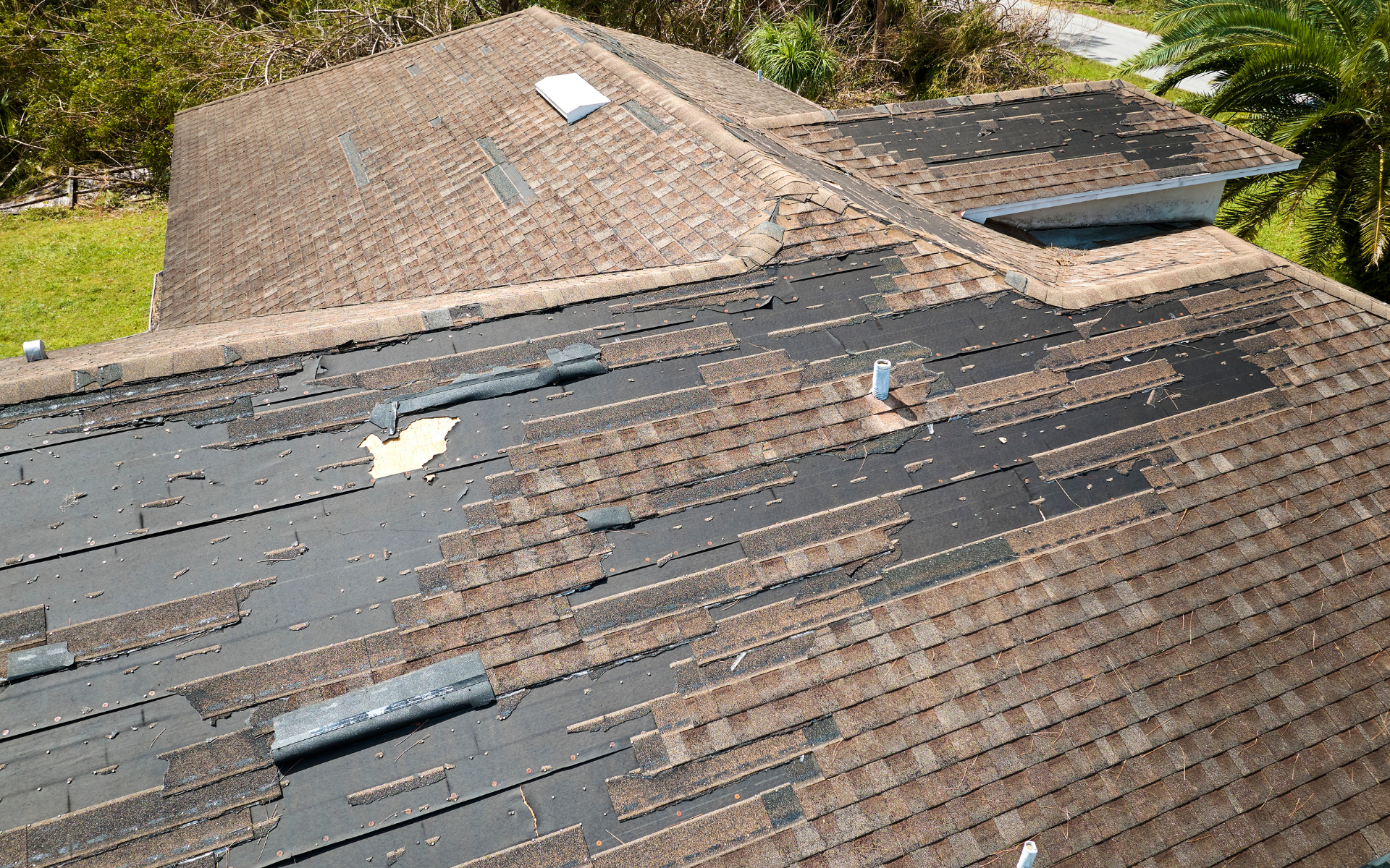 Roof damaged from wind and hail.