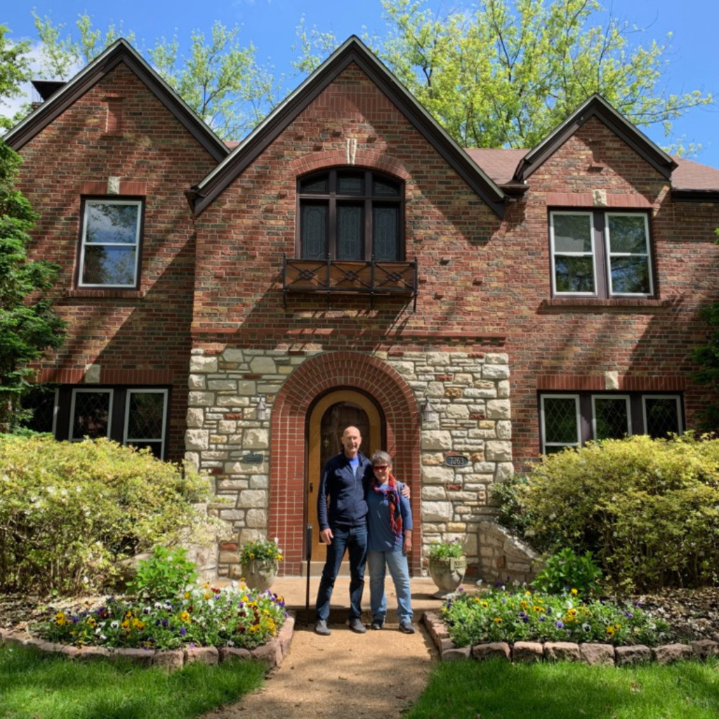 Retirees in front of their University City home in St. Louis.