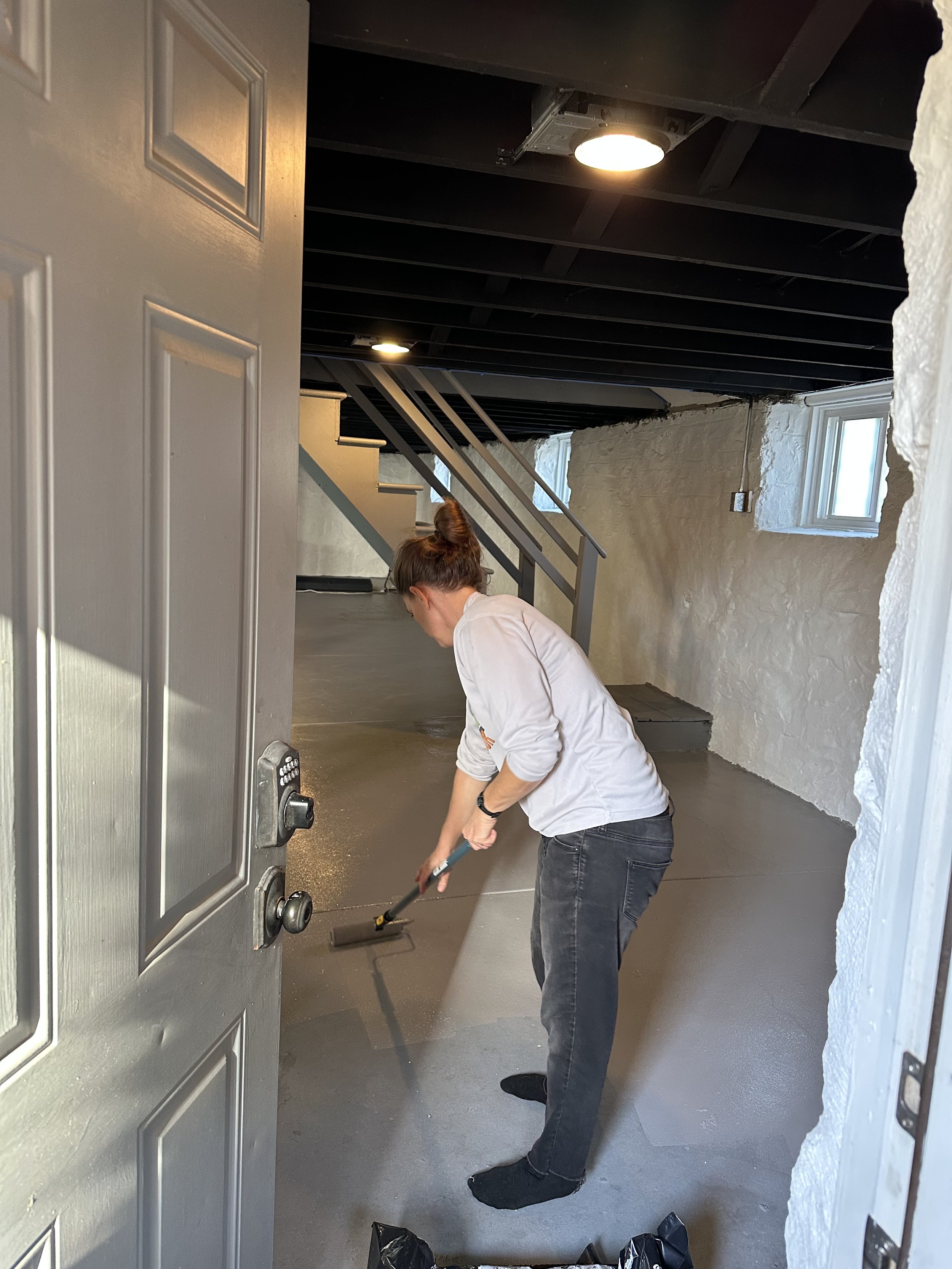 Painting floor of basement.