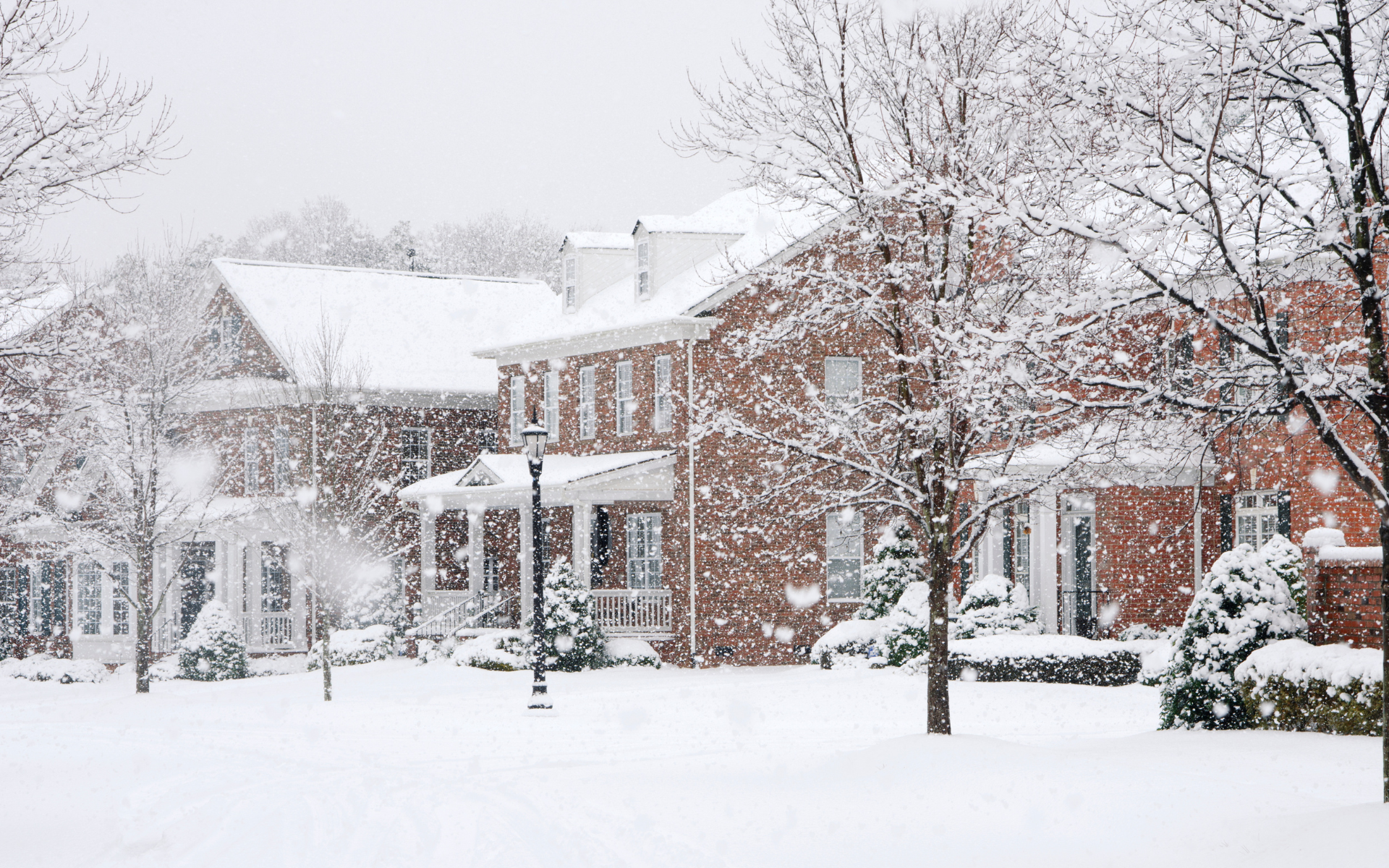 row of houses covered in snow