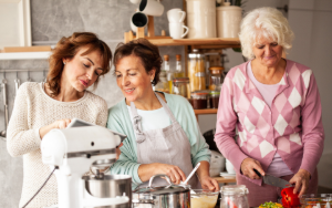 Seniors cohousing working together in the kitchen, a shared common area