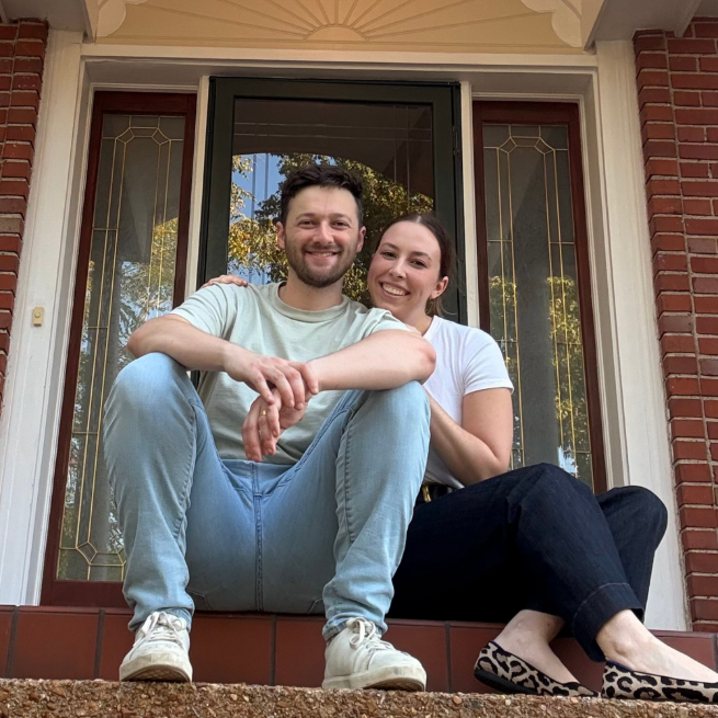 Happy couple at new home in University City after selling home in Webster Groves