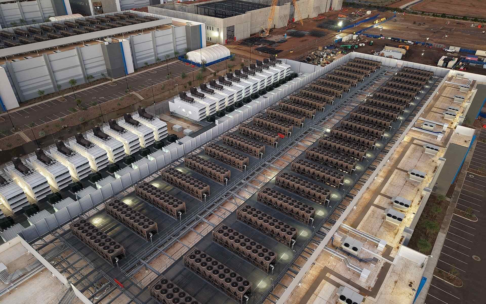 Aerial view of a large-scale industrial data center facility in the Midwest with external cooling units.