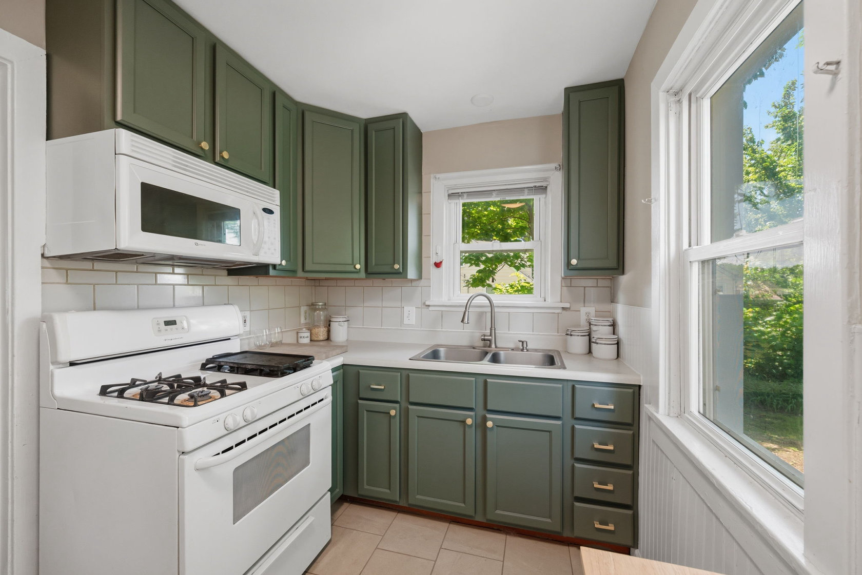 kitchen with gray cabinets - 10411 Maddox Place St. Louis Missouri