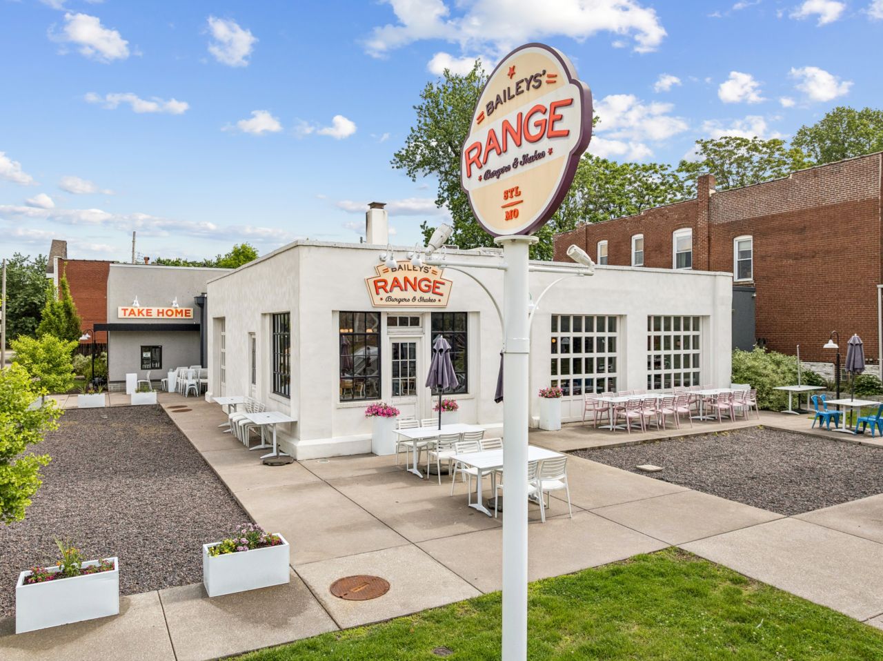 Outdoor seating at restaurant in former neighborhood service station, completely rehabbed with historic preservation in mind. 4175 Shaw Blvd in St. Louis Missouri