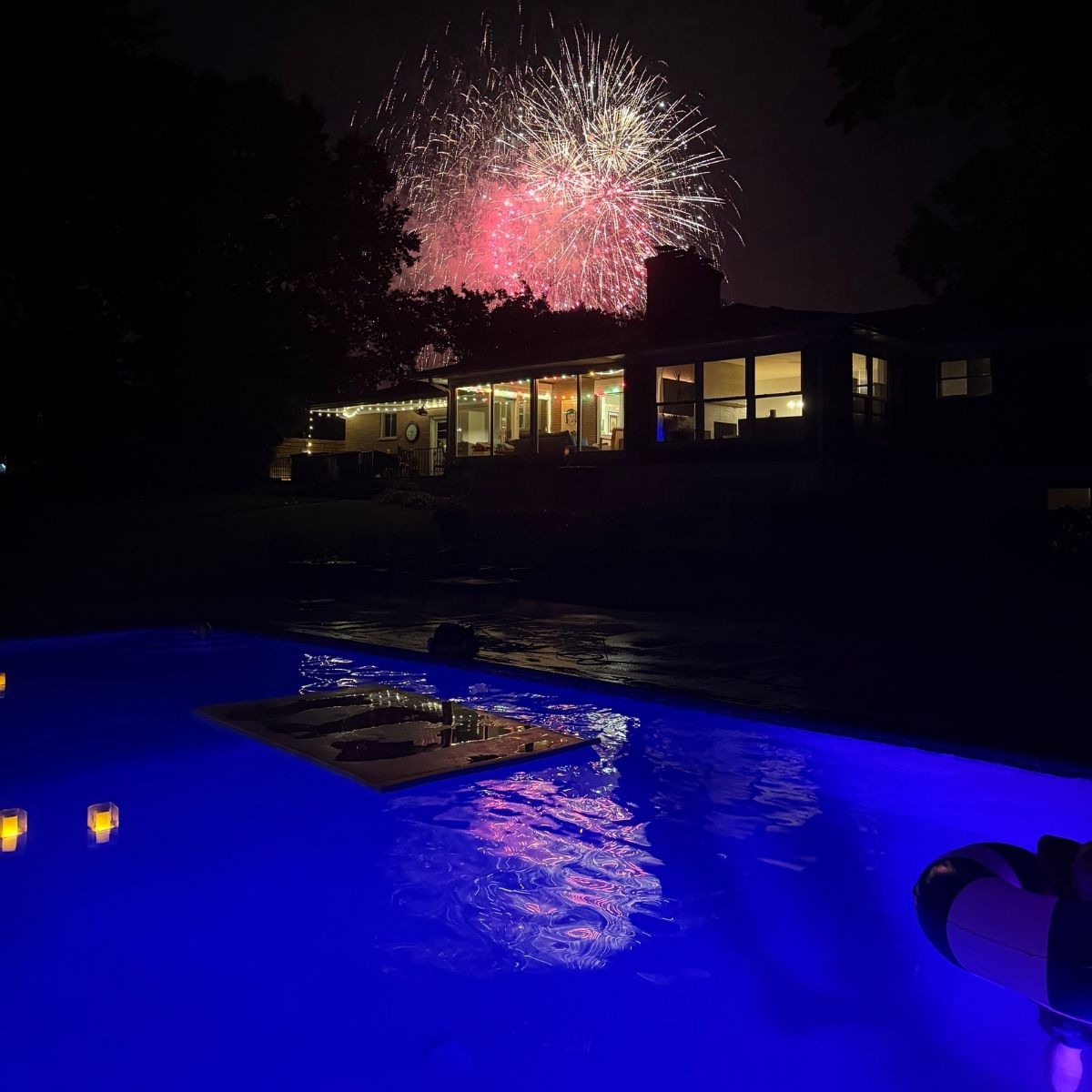 Kirkwood Fireworks from the Swimming Pool - real cost of owning a pool in St. Louis backyard