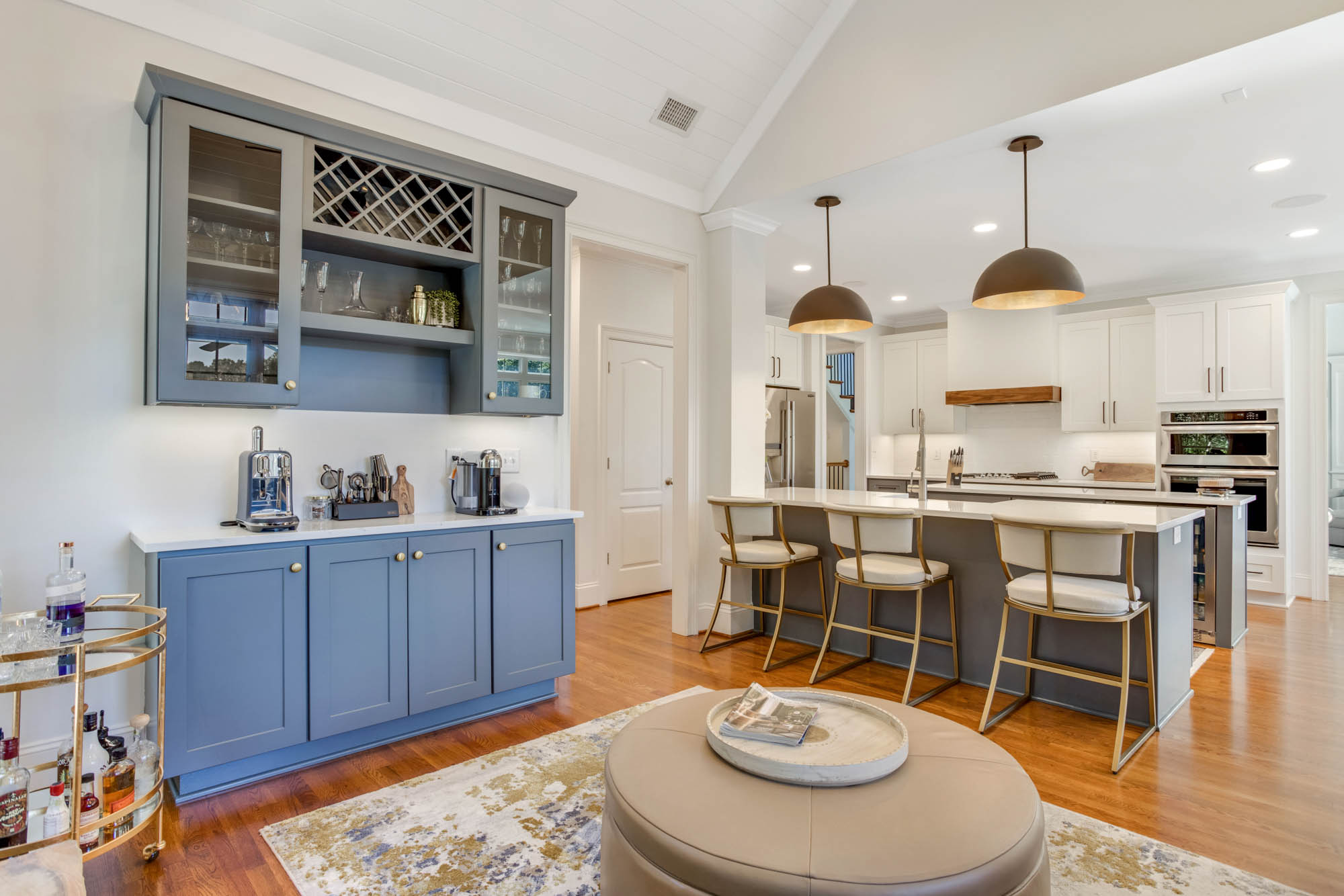 Wet bar off of kitchen with storage