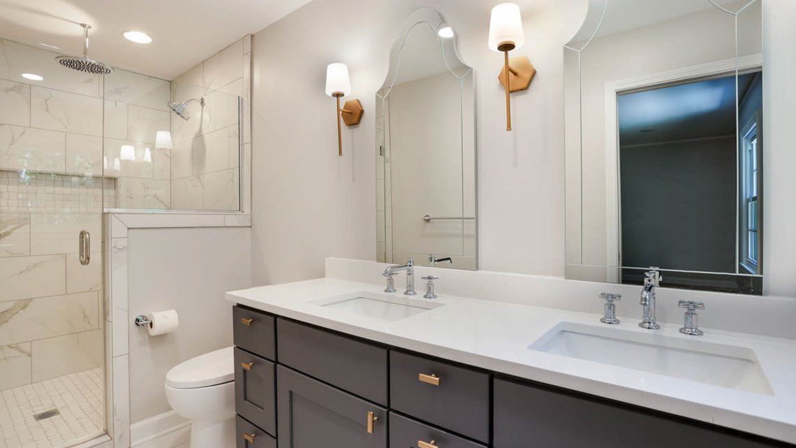 Traditional blue and white primary bathroom remodel