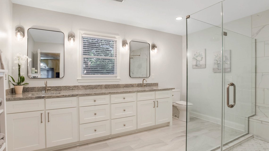 Bathroom remodel with glass shower and double vanity