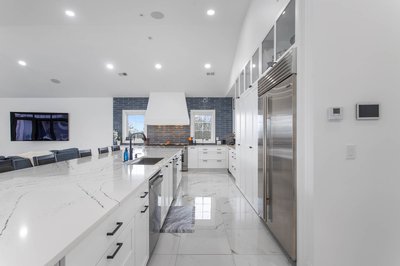 White kitchen with large island and lots of cabinetry