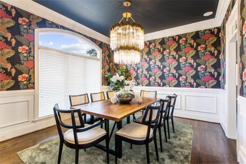 Bright flowered wallpaper dining room with modern chandelier