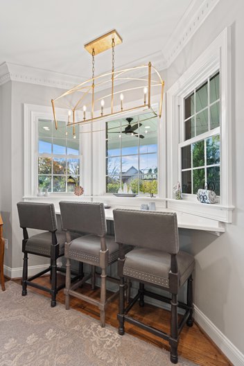 Kitchen nook with bar facing windows