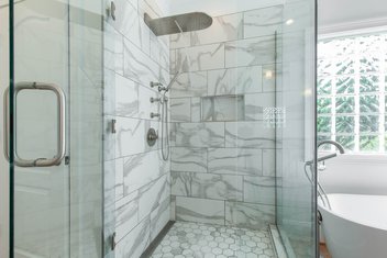 White bathroom with tiled shower