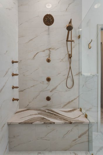 White and brown marbled tile shower
