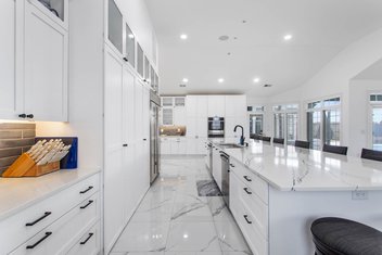White kitchen with large island and lots of cabinetry