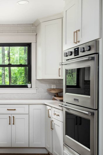White kitchen with black windows
