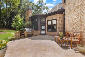 Travertine patio in backyard