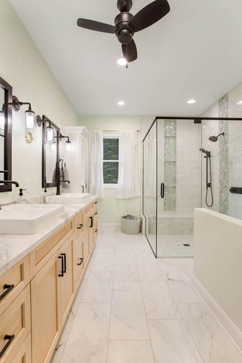 Sherwin Williams White Mint primary bathroom remodel with glass shower and double vanity