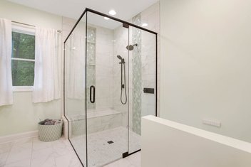 Sherwin Williams White Mint primary bathroom remodel with glass shower and double vanity