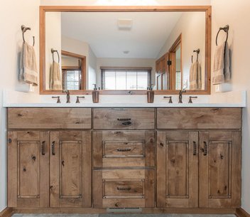Bathroom with stained wood vanity