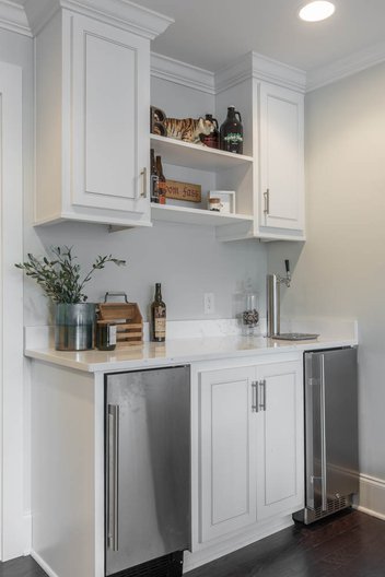 white mini bar with sink and refrigerator
