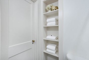 White cabinet storage with towels
