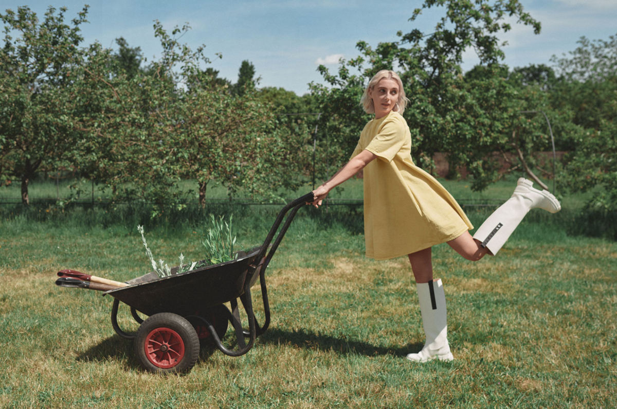 Emma Chamberlain Plays In A Garden In The GANNI X Levi’s Campaign