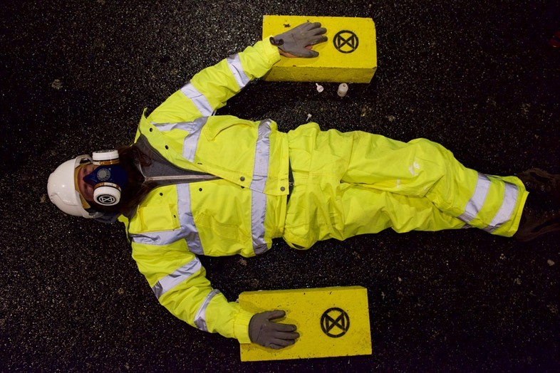 Extinction Rebellion Glue Themselves To London Road In A Fight On Air Pollution