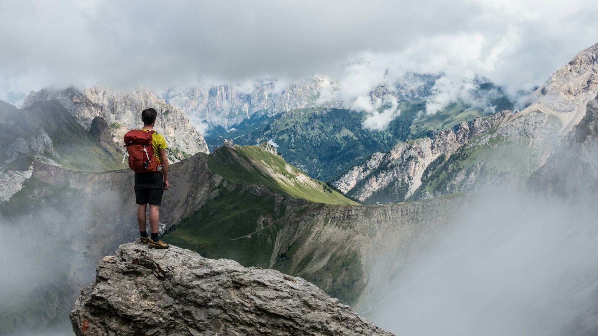 Tour operator overlooking a mountain landscape
