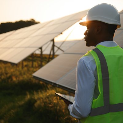 African man working at solar farm