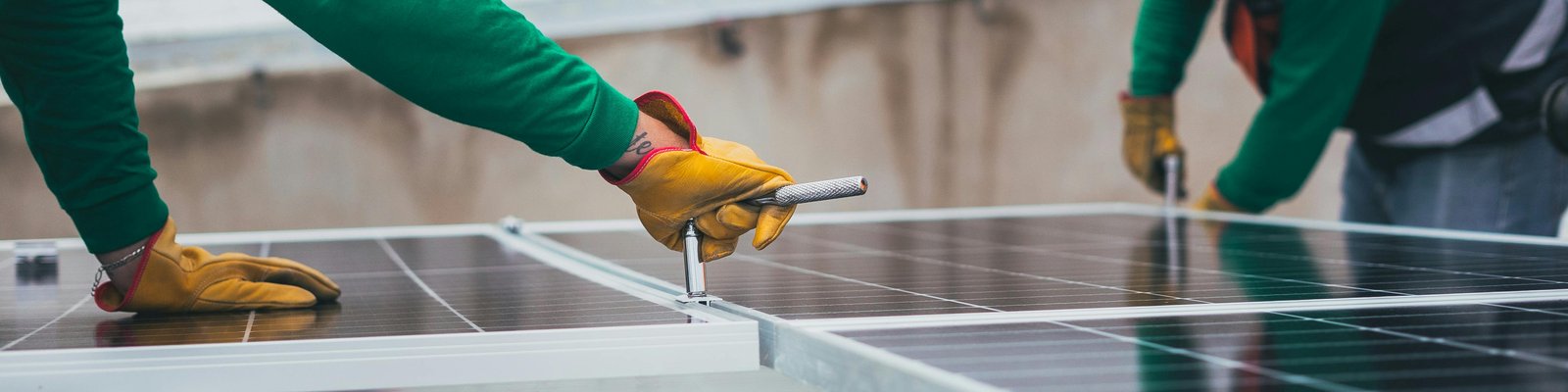 Workers installing solar panels