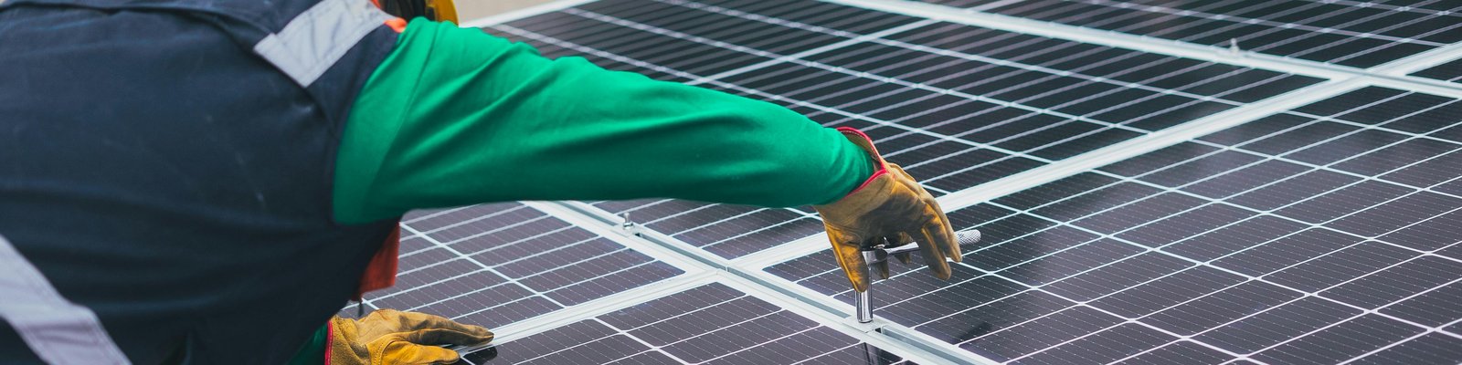 Workers installing solar panels